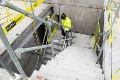 Edge protection on concrete stairs on construction site UK